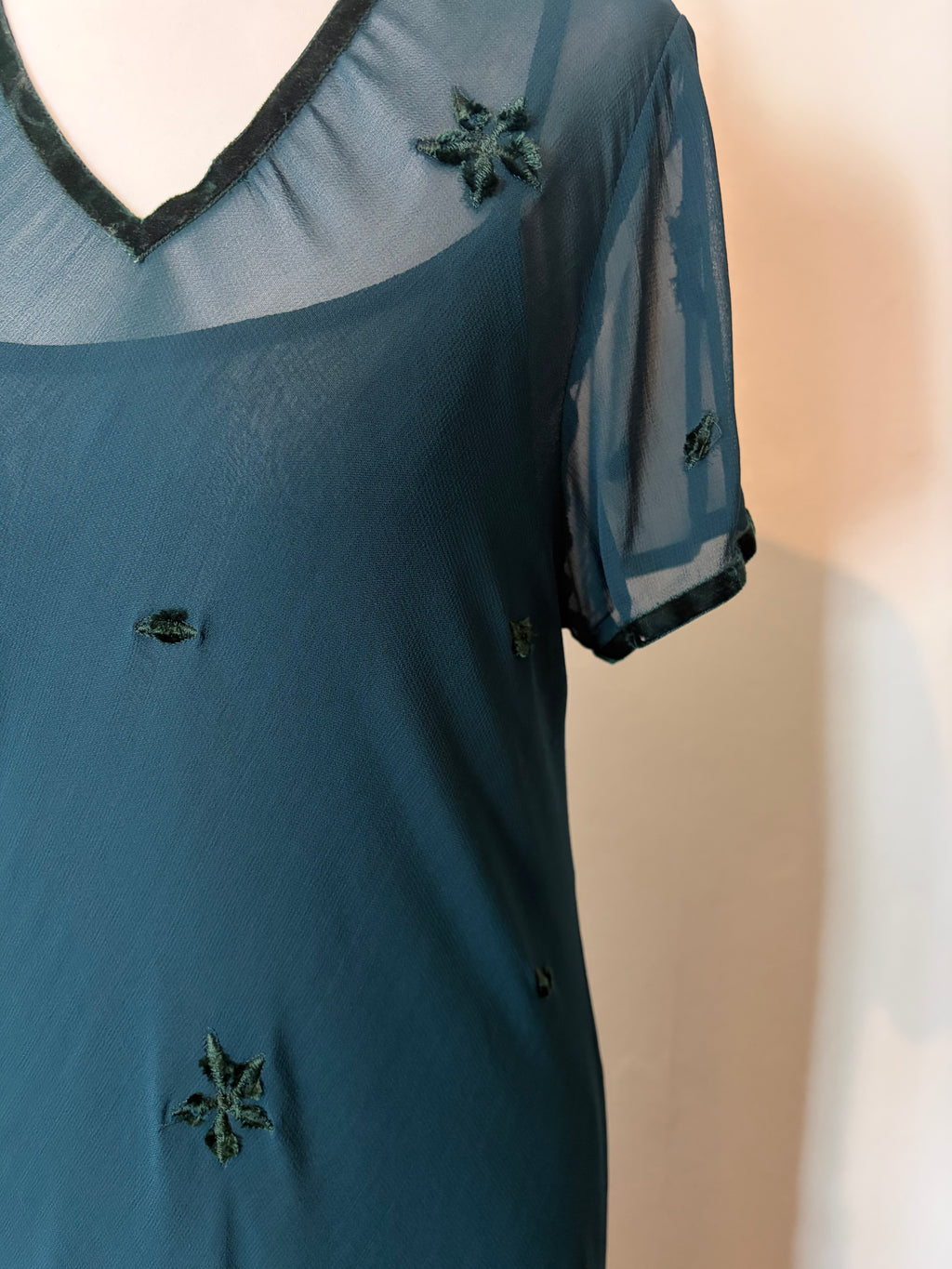 Emerald green dress with velvet details