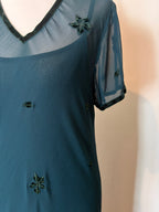 Emerald green dress with velvet details