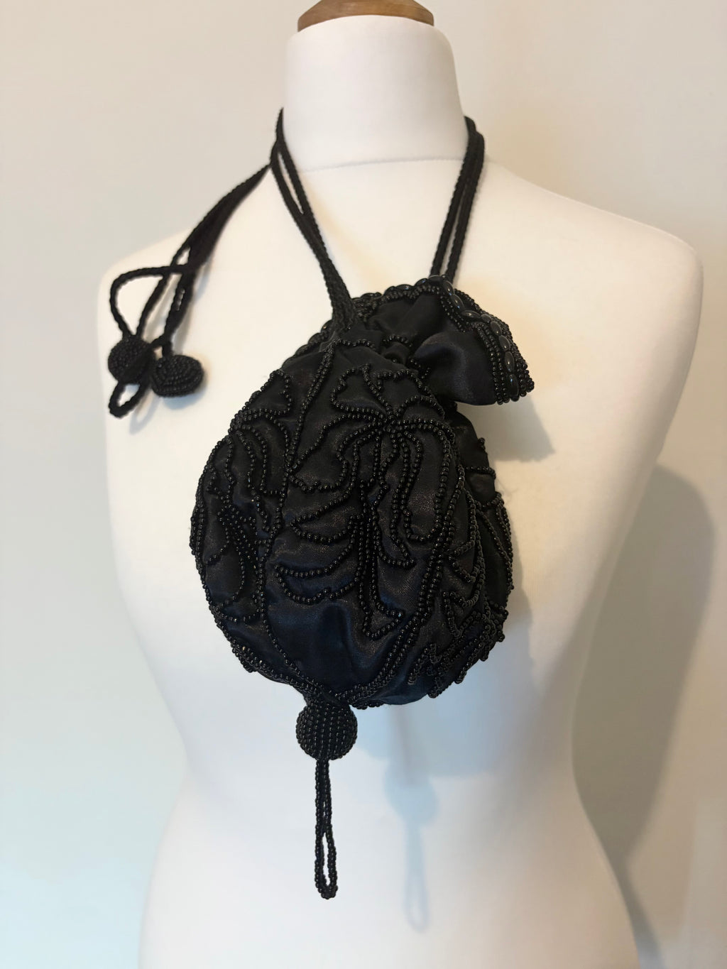 Drawstring beaded bag with tassel