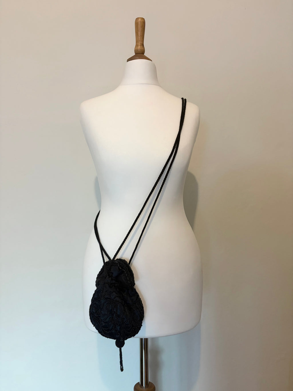 Drawstring beaded bag with tassel