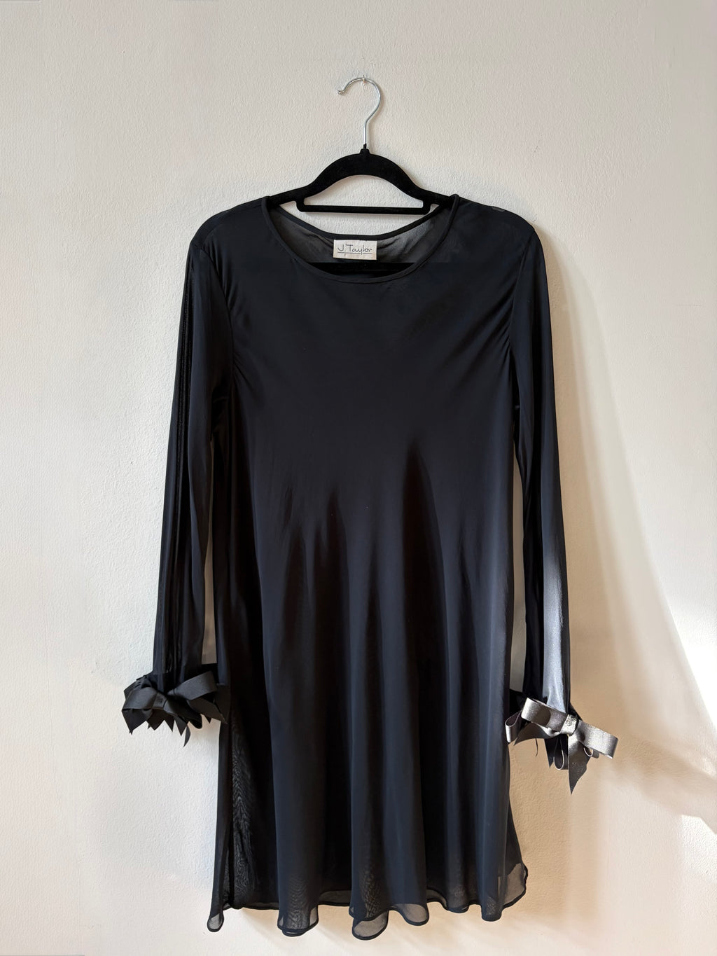 Black mini dress with bow sleeve details