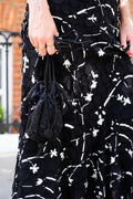 Drawstring beaded bag with tassel