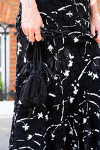 Drawstring beaded bag with tassel