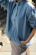 Blue funnel neck bomber jacket