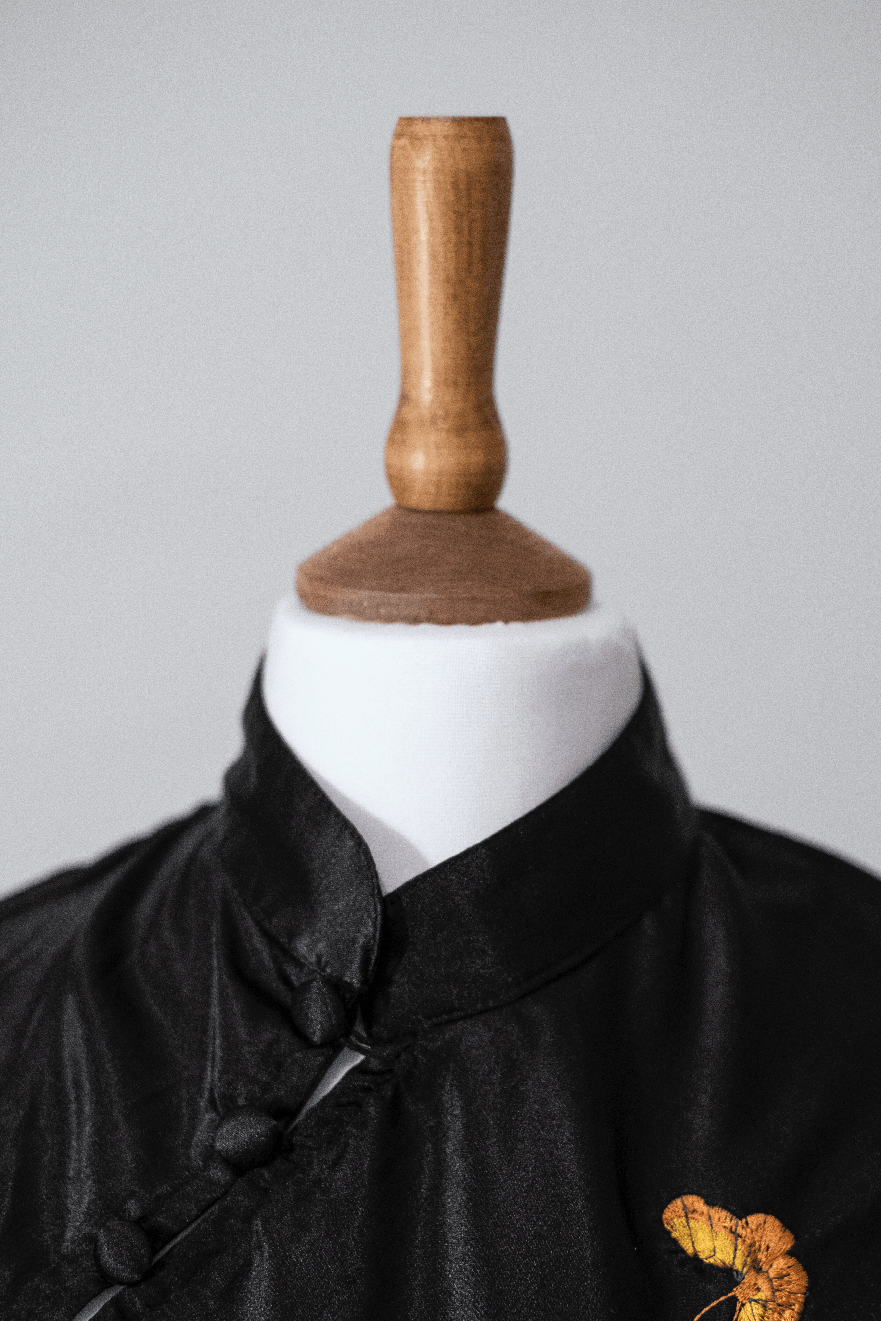 Embroidered black button top