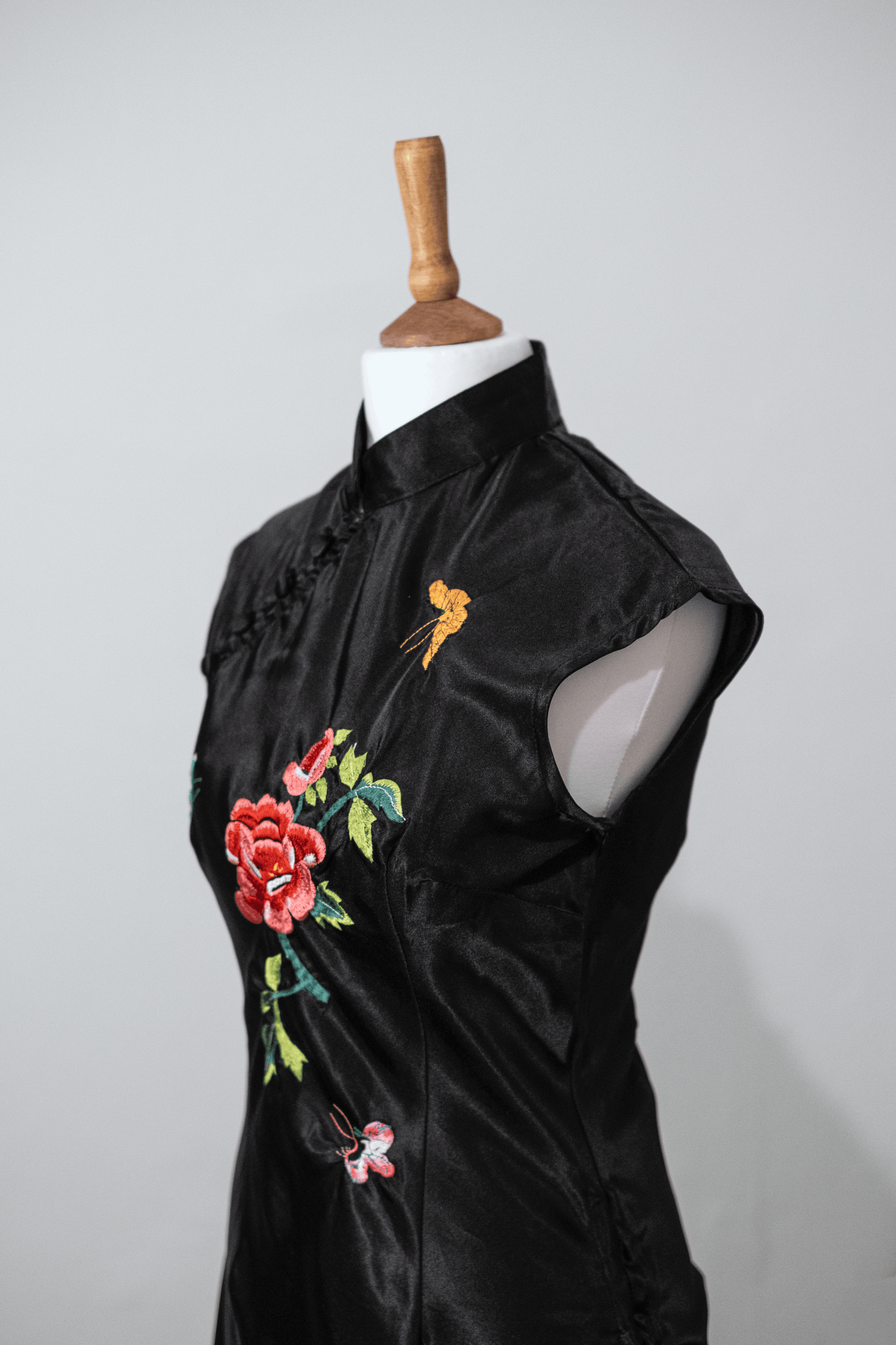 Embroidered black button top