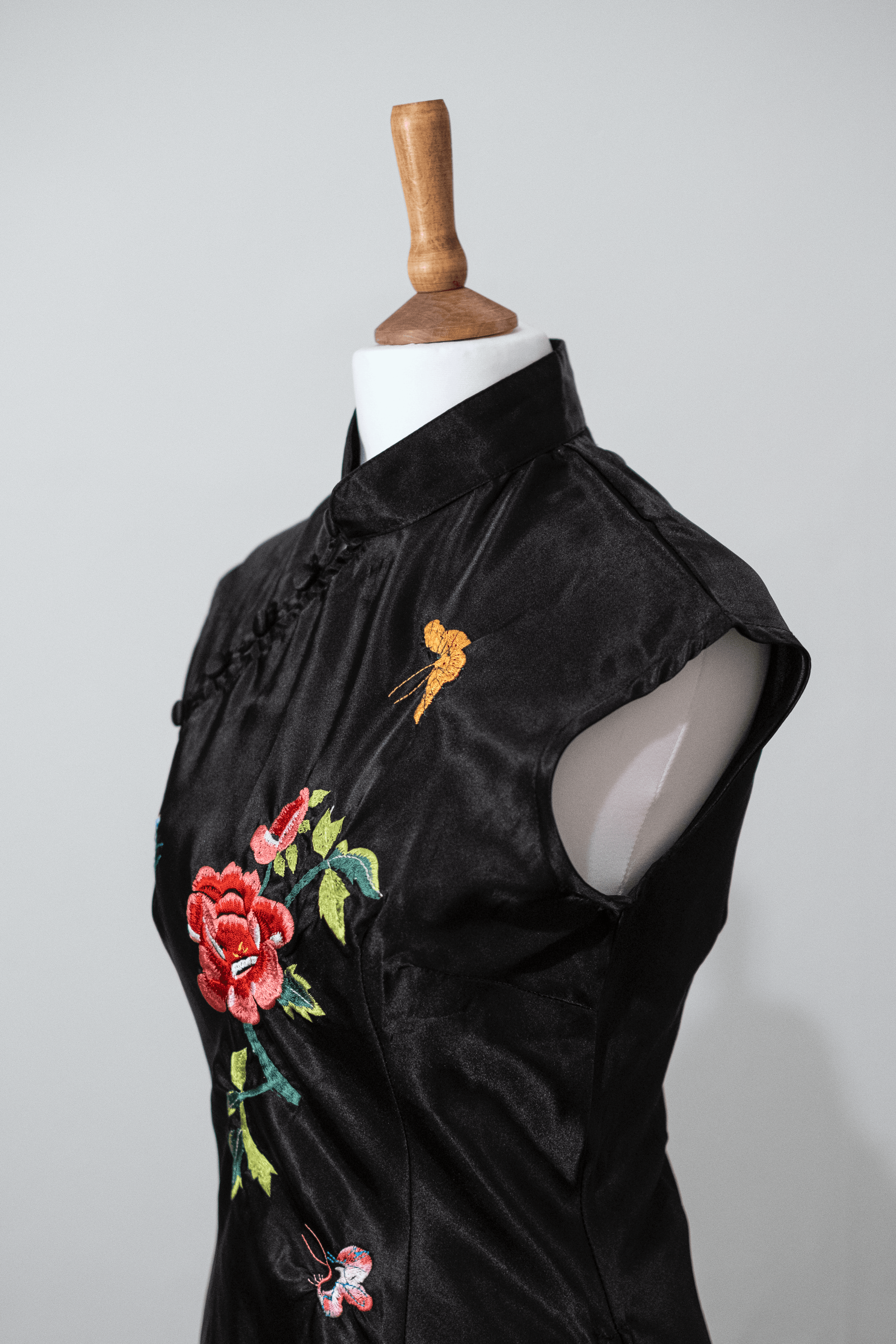 Embroidered black button top