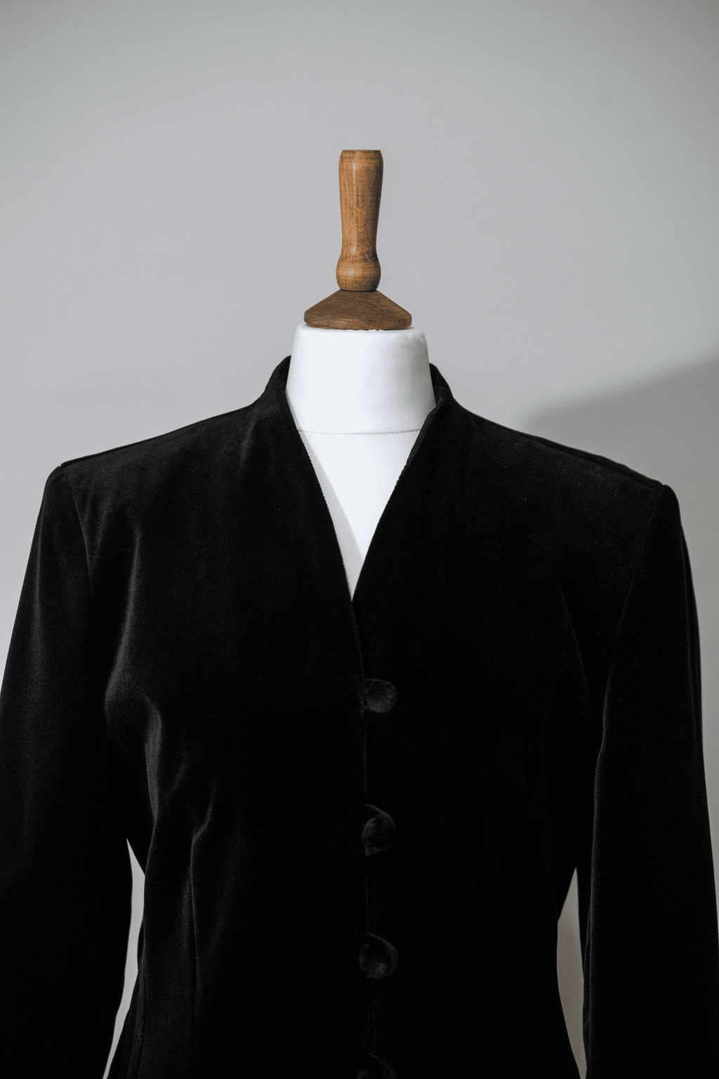 Black velvet jacket with covered buttons