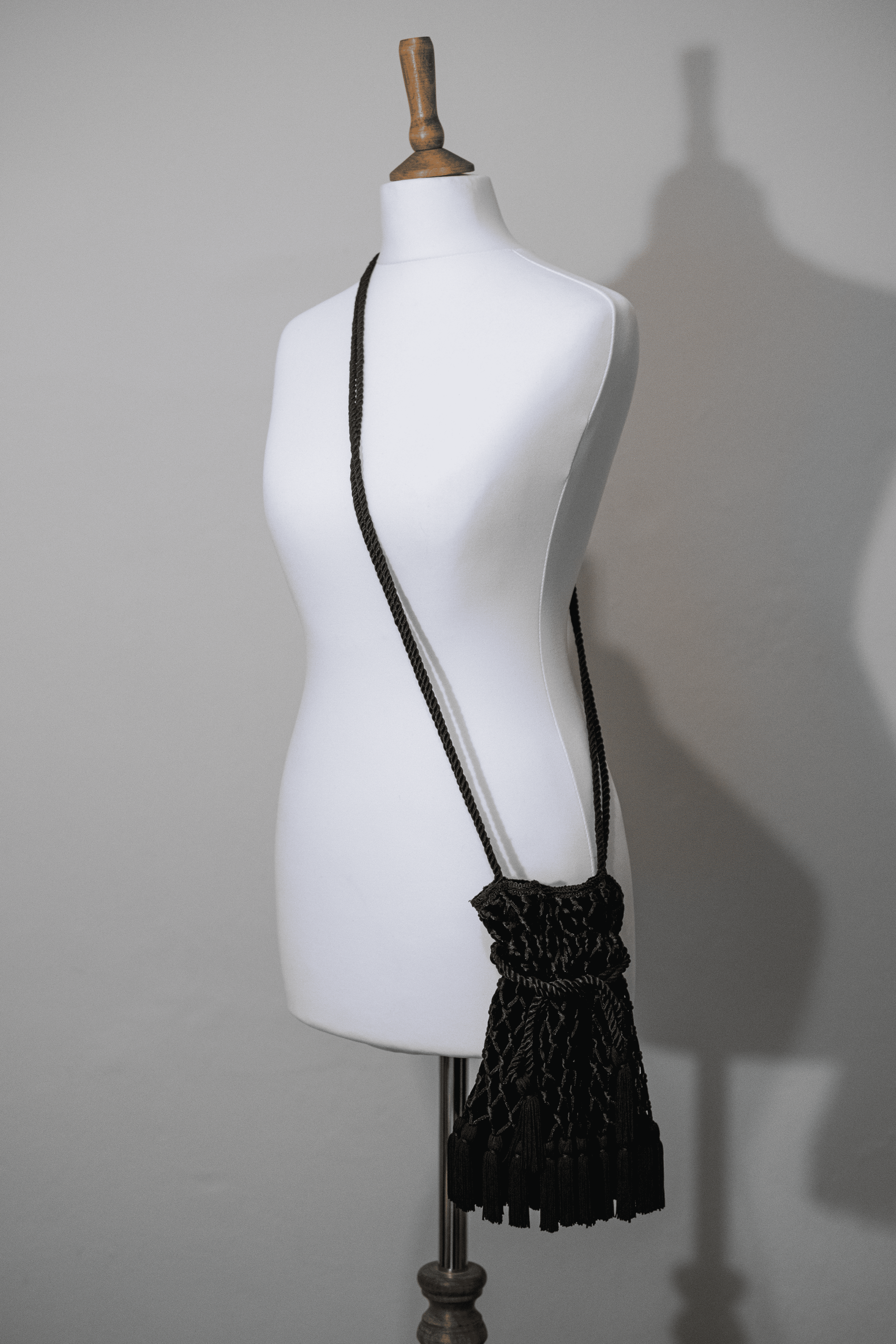 Tassel detail velvet bag