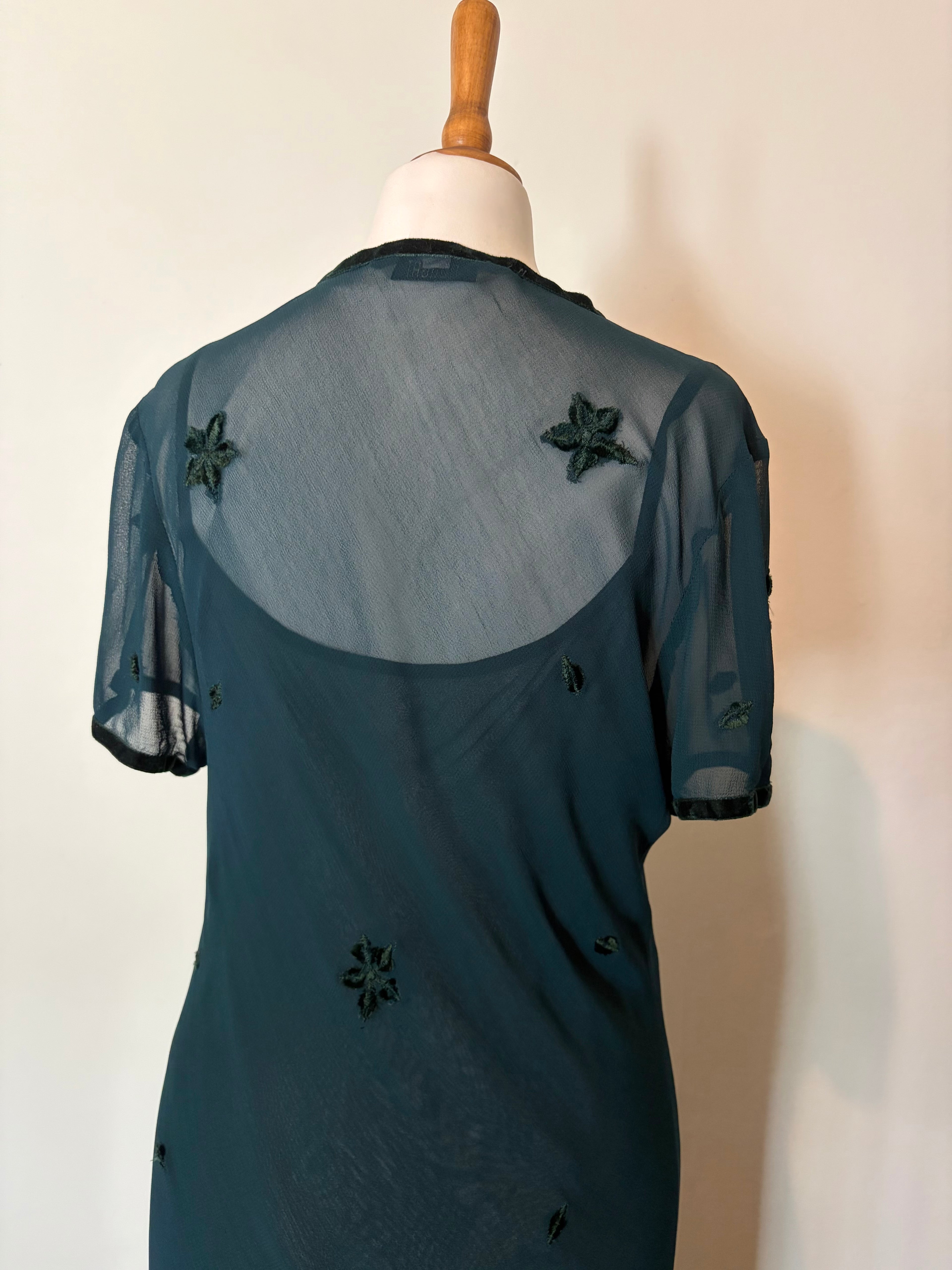 Emerald green dress with velvet details