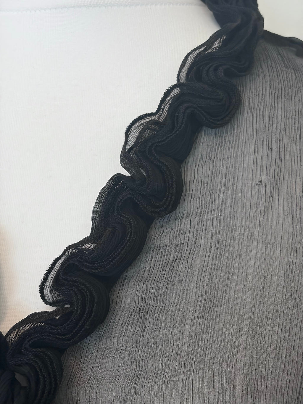 Black sheer top with ruffles