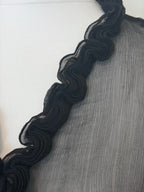 Black sheer top with ruffles