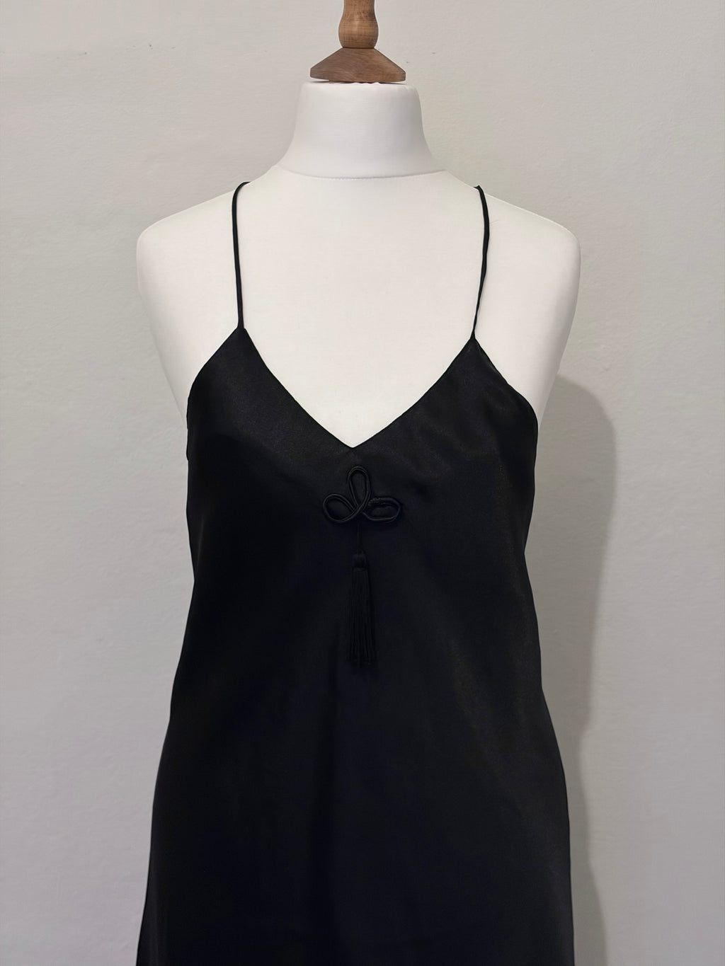 Black slip dress with tassel detail