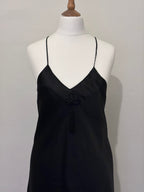 Black slip dress with tassel detail