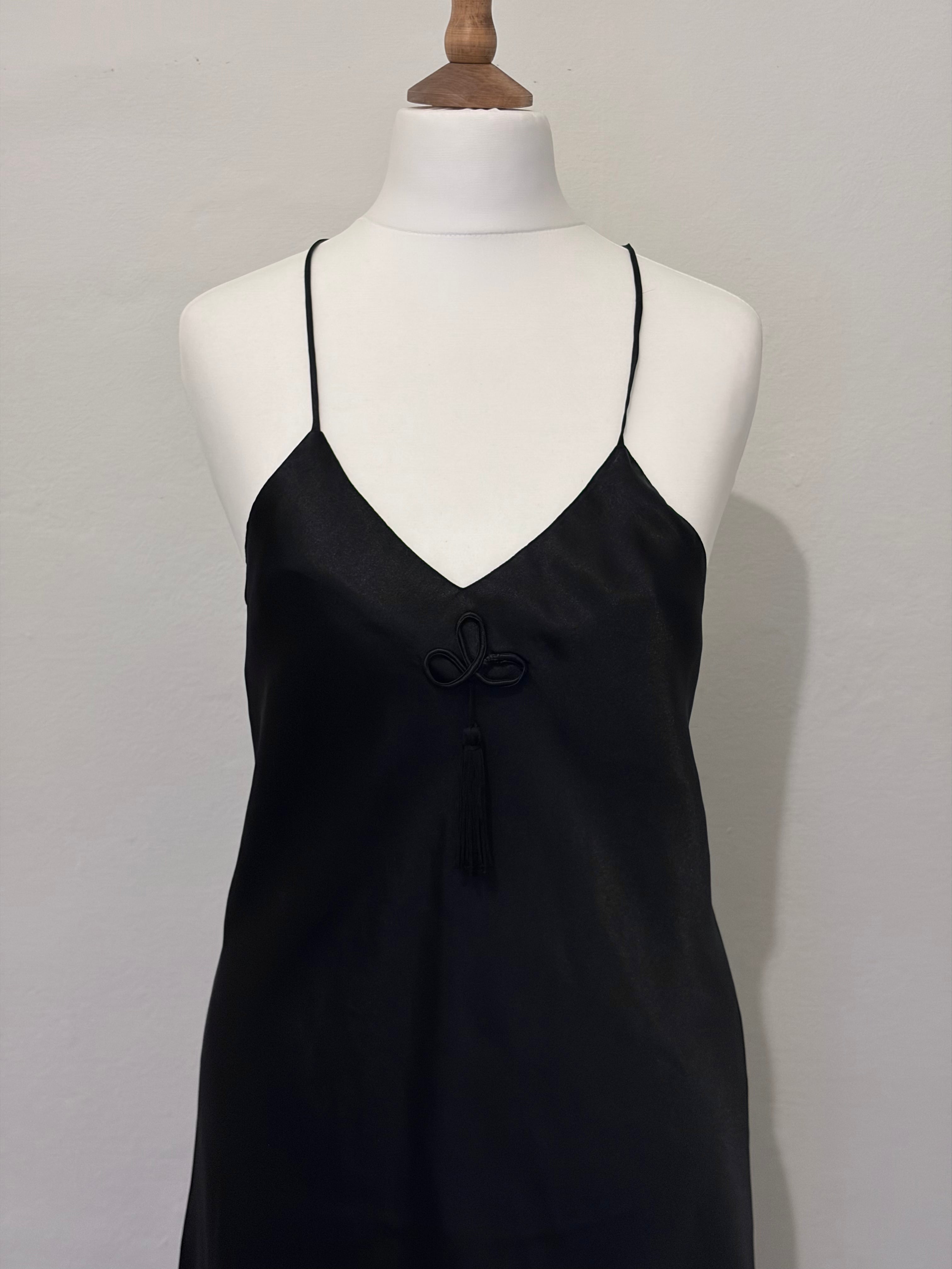 Black slip dress with tassel detail