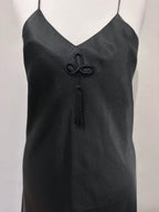 Black slip dress with tassel detail