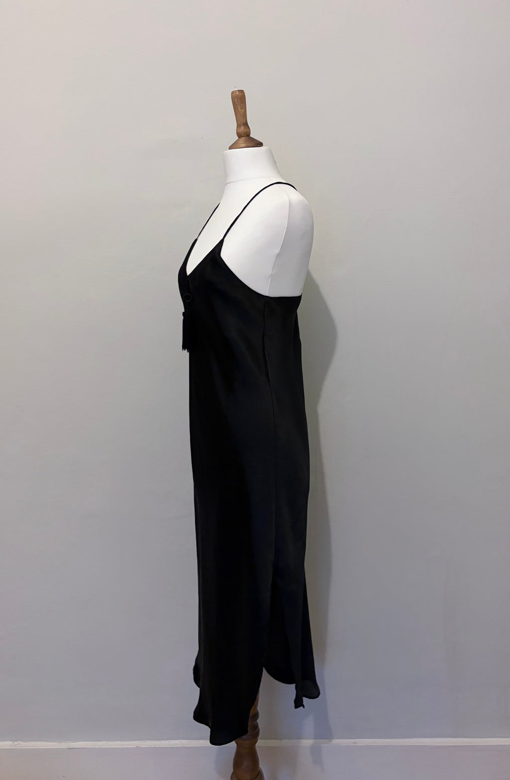 Black slip dress with tassel detail