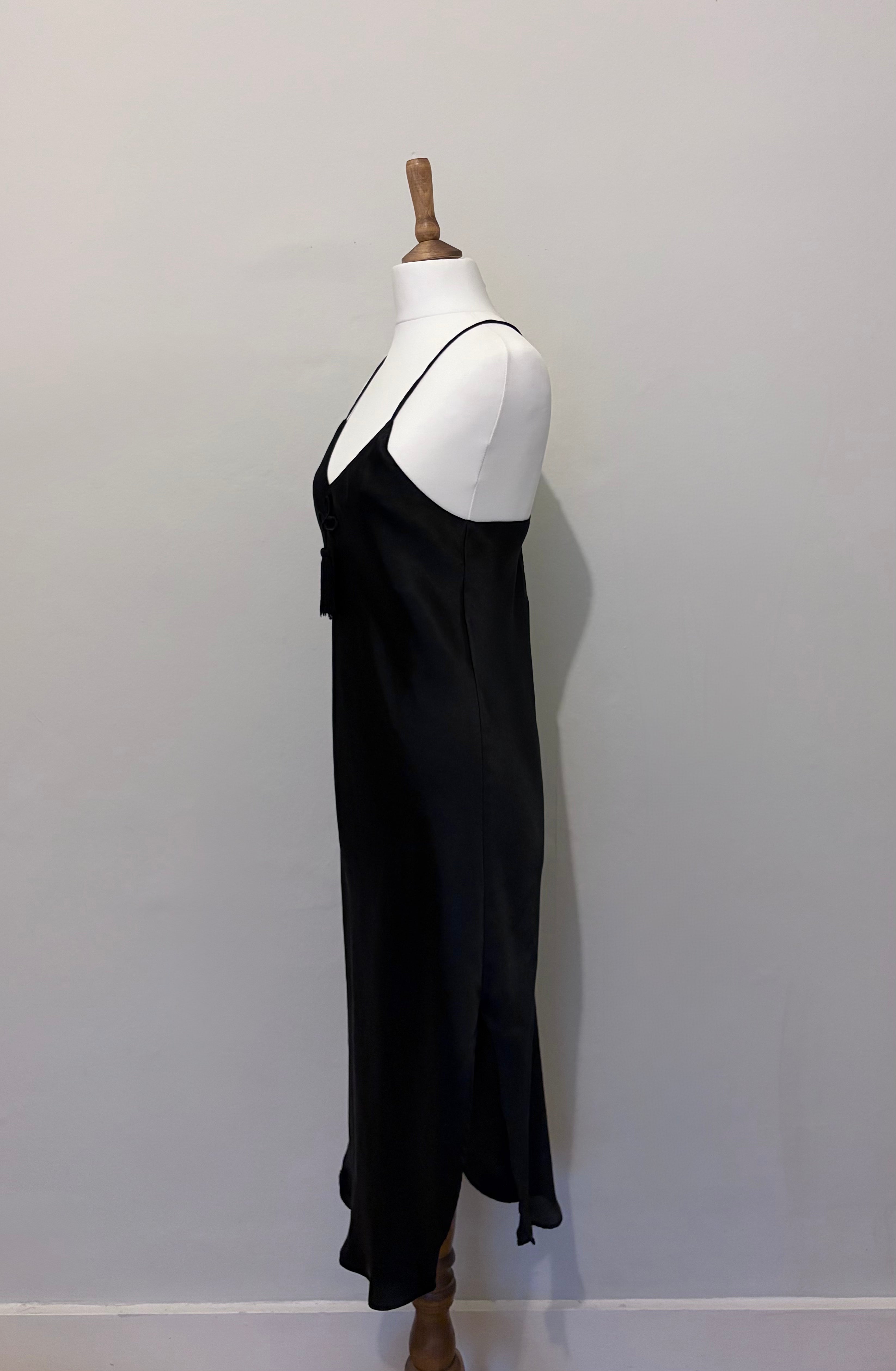 Black slip dress with tassel detail