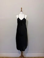 Black slip dress with tassel detail