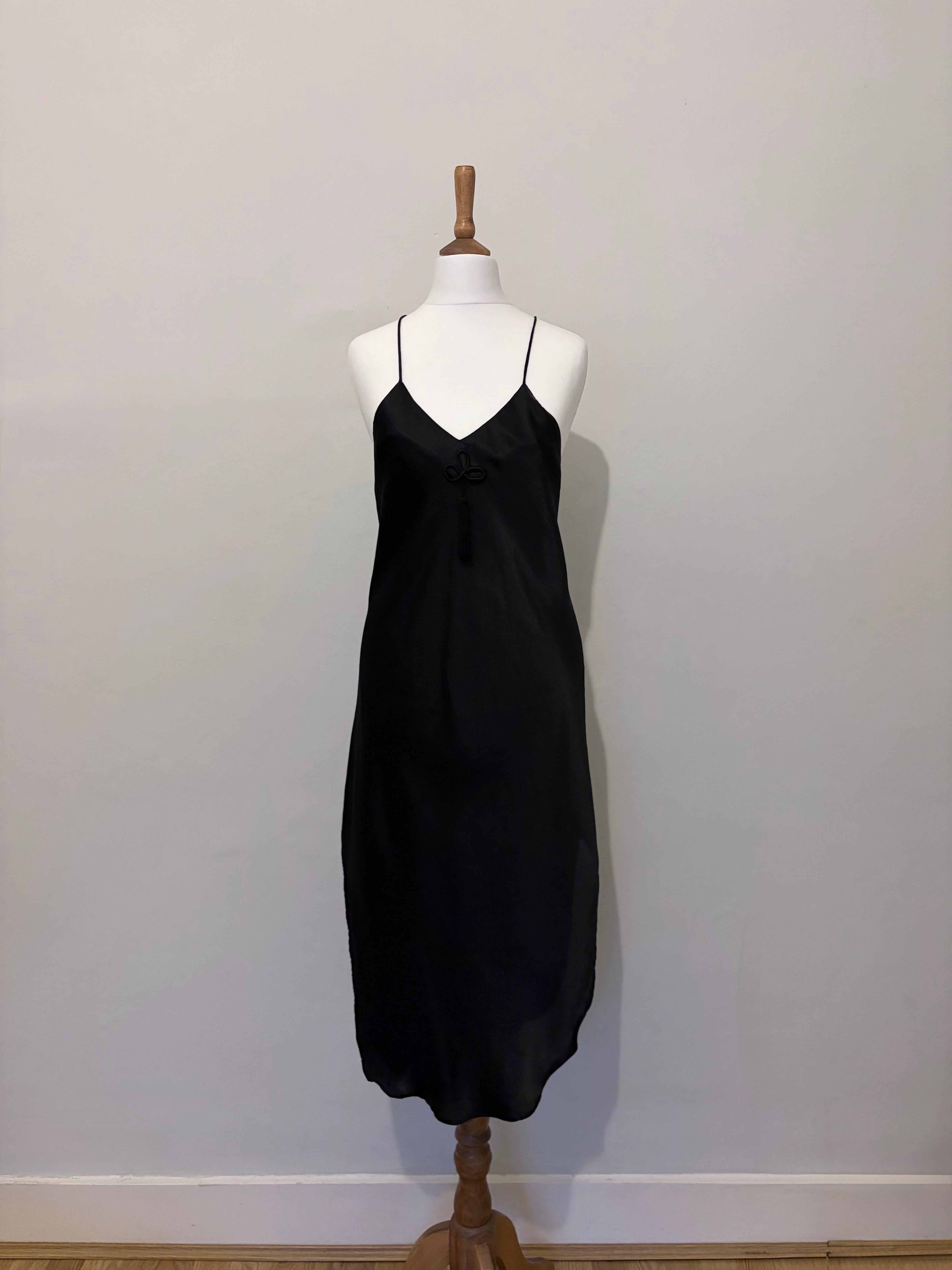 Black slip dress with tassel detail
