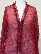 Red sheer top with ruffle detailing