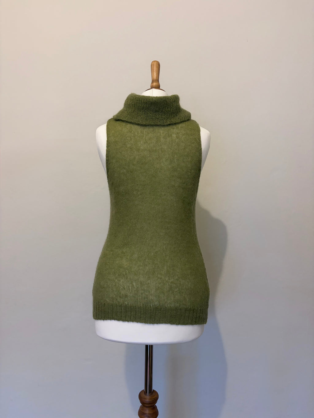 Green knitted roll neck jumper