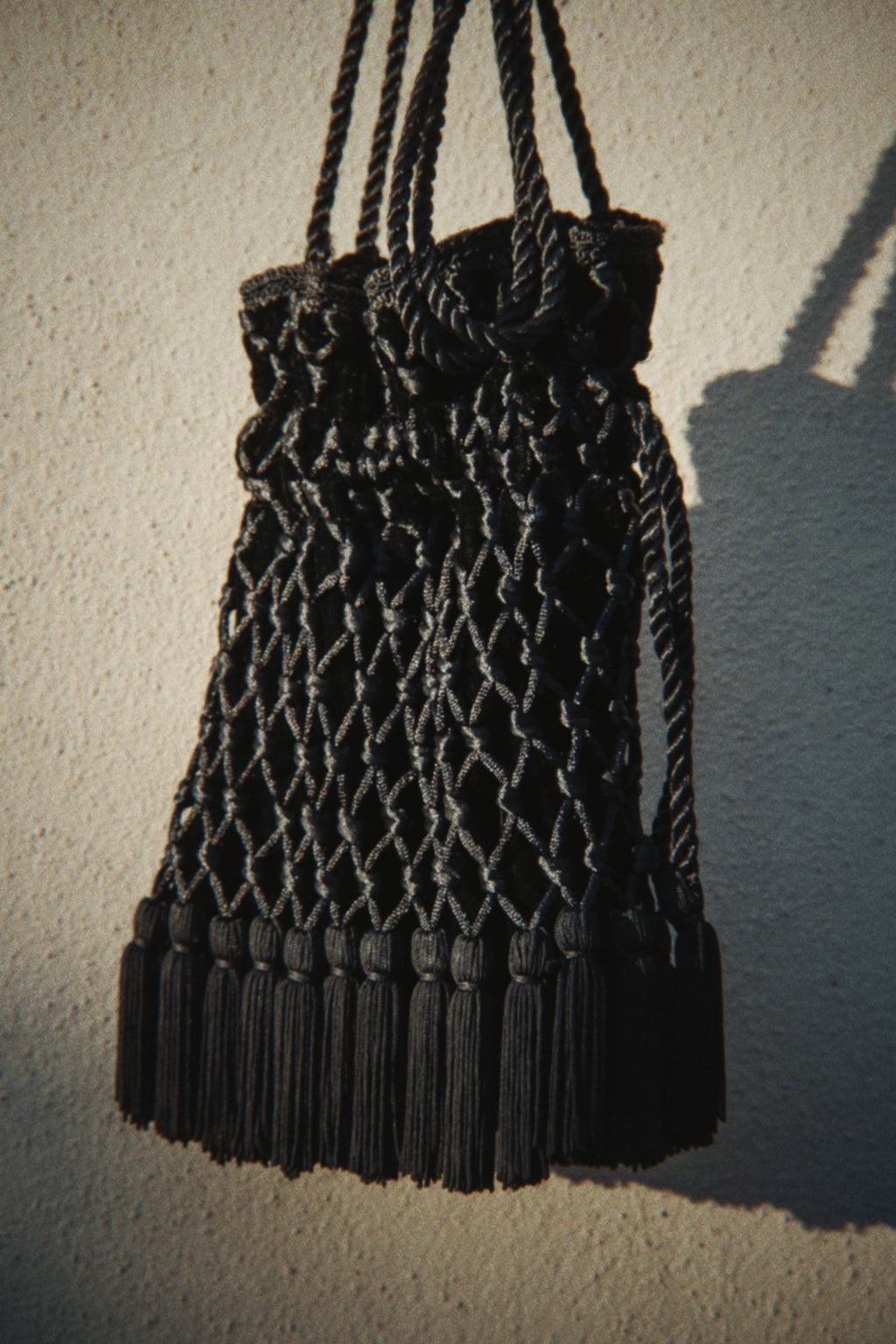 Tassel detail velvet bag