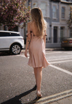 Blush satin dress with sequin flowers