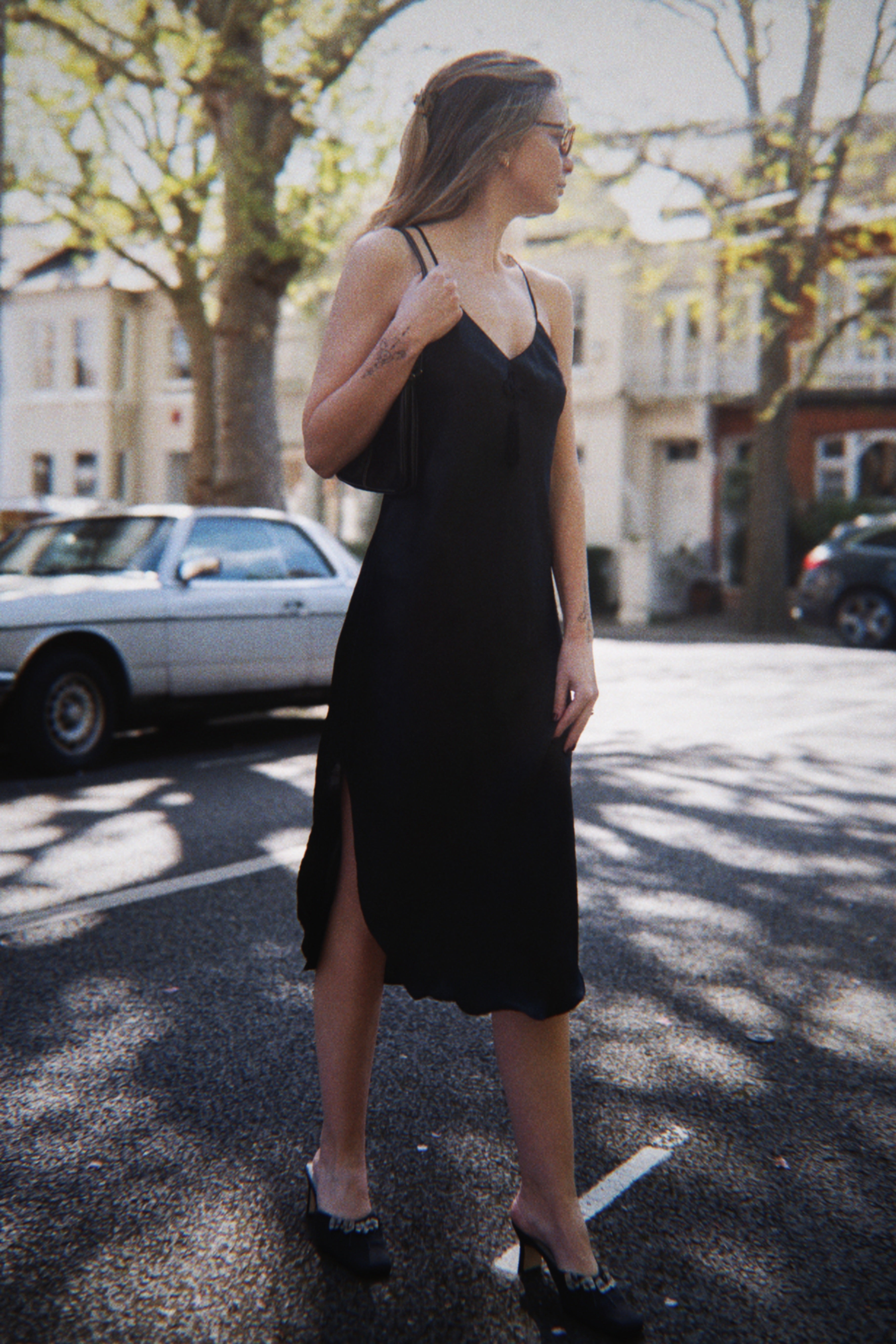 Black slip dress with tassel detail