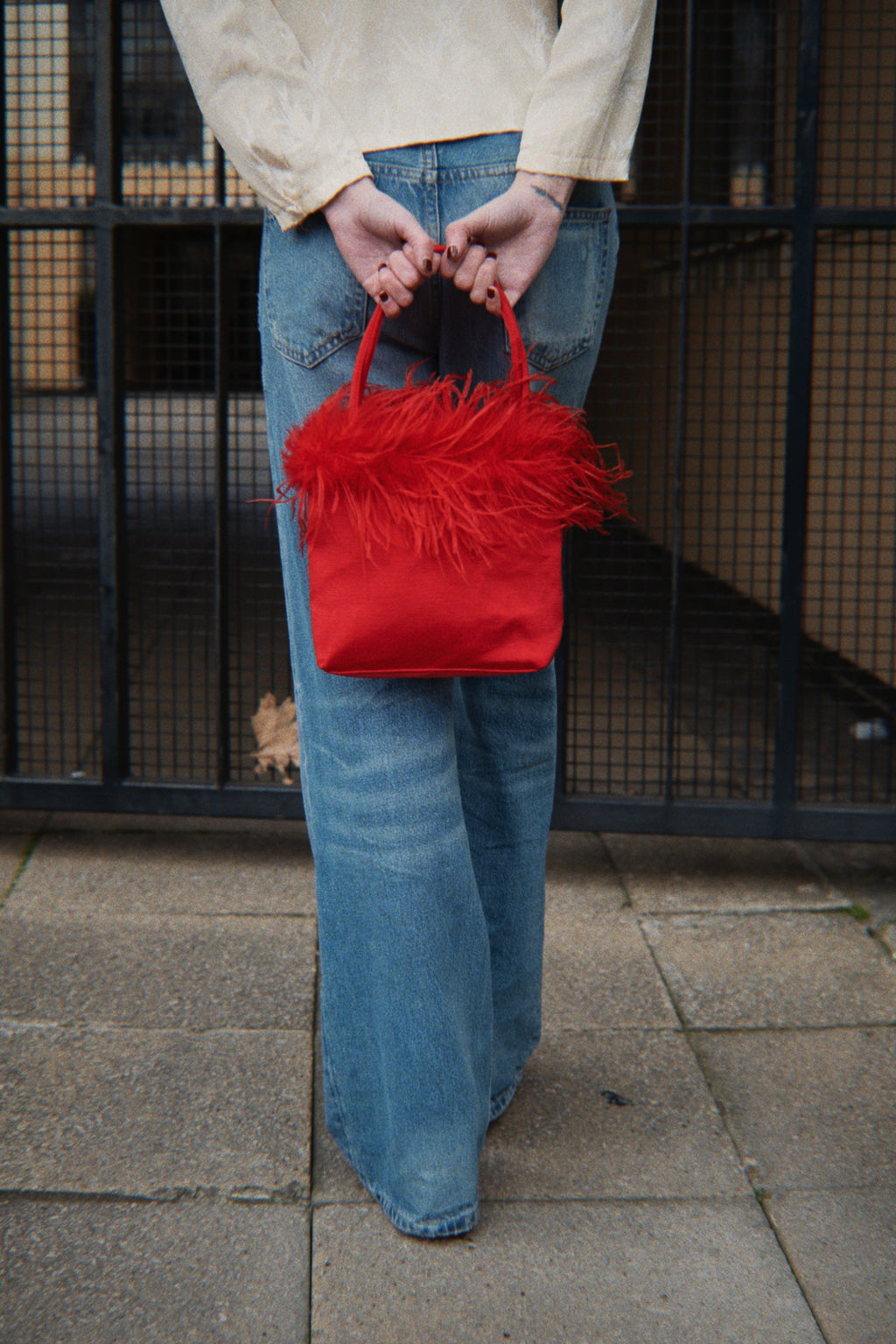 Red feather detail bag